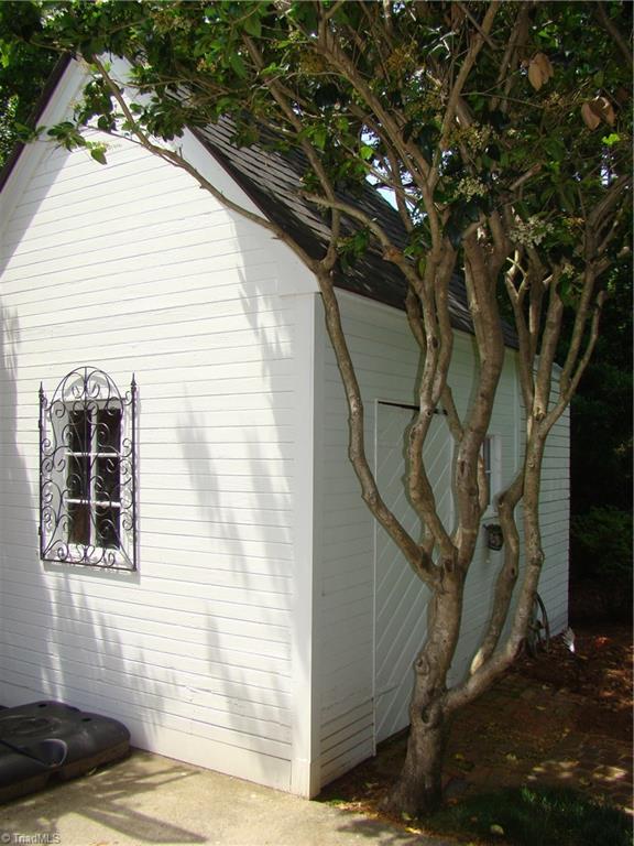 3614 Pinetop Road Greensboro, NC 27410 - Photo 26 of 30 Quaint storage shed blends perfectly into the beautiful back yard setting.