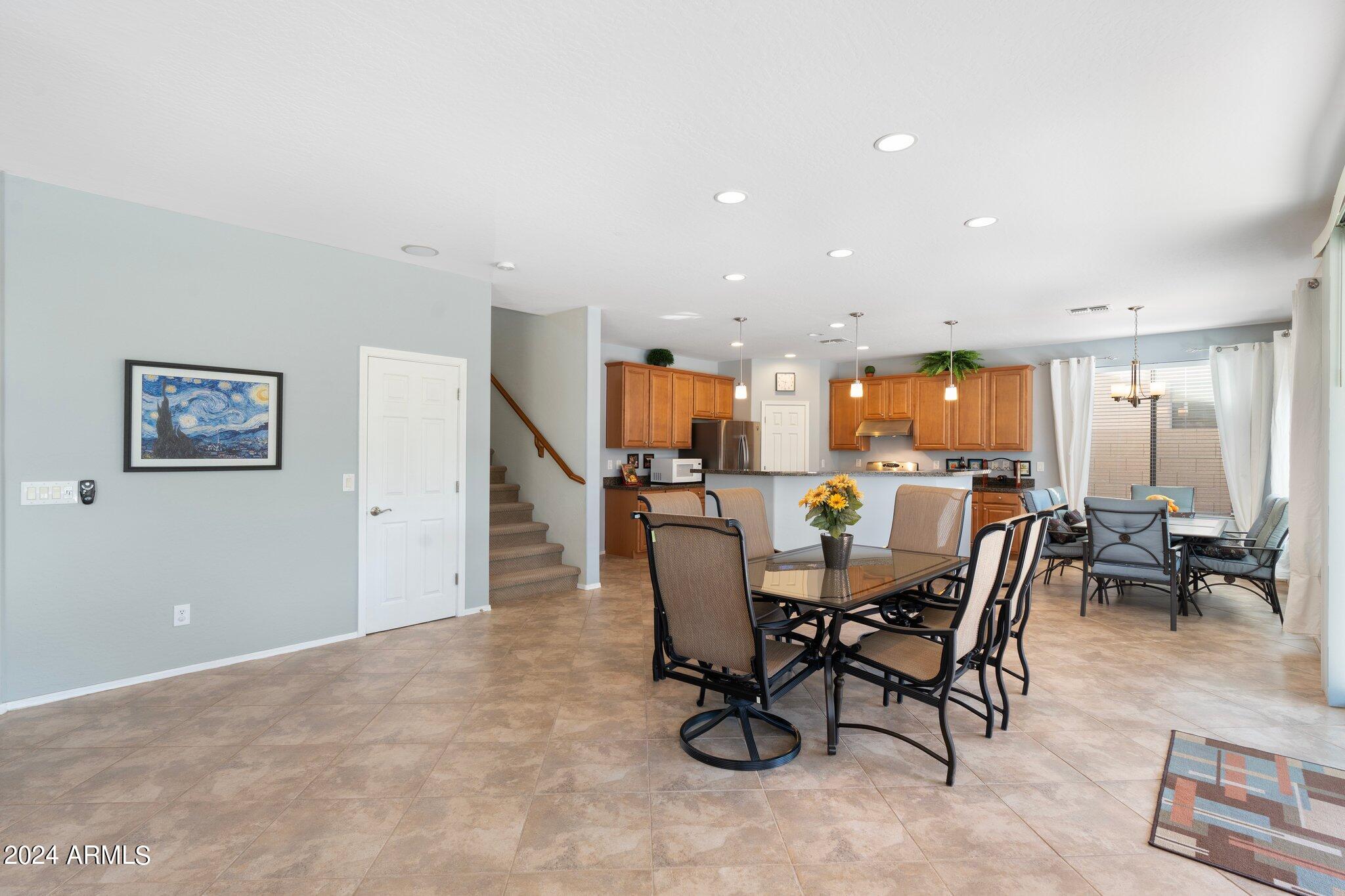 4427 West Summerside Road Laveen, AZ 85339 - Photo 13 of 72 a view of a dining room with furniture