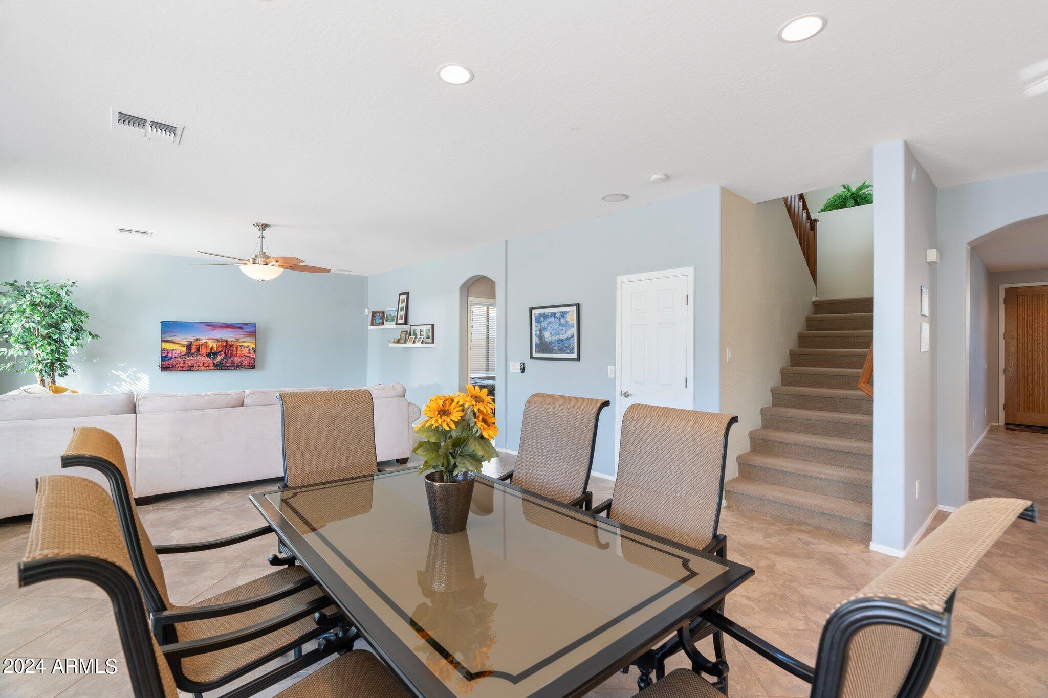 4427 West Summerside Road Laveen, AZ 85339 - Photo 16 of 72 a view of a dining room with furniture