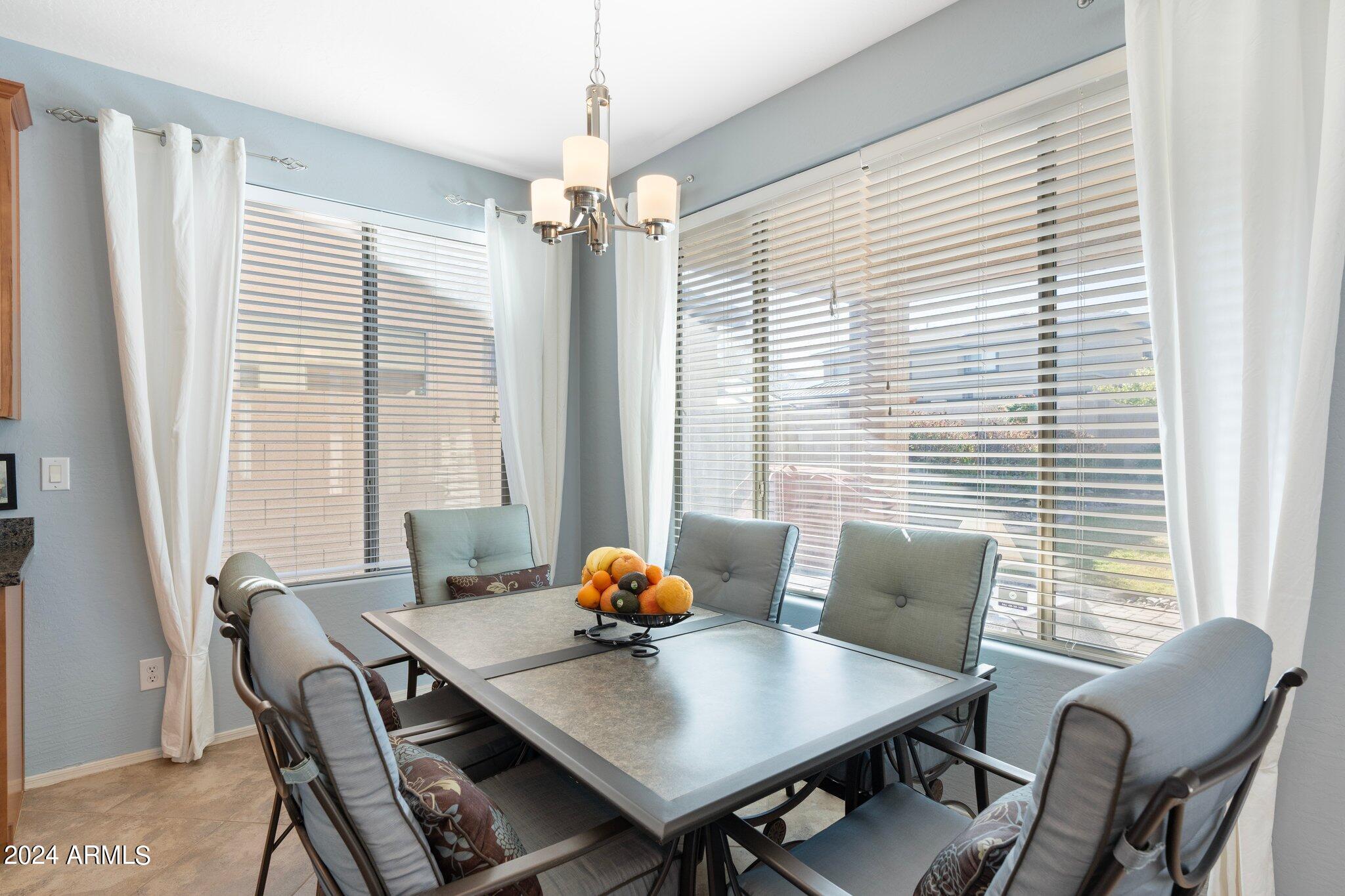 4427 West Summerside Road Laveen, AZ 85339 - Photo 18 of 72 a view of a dining room with furniture window and outside view