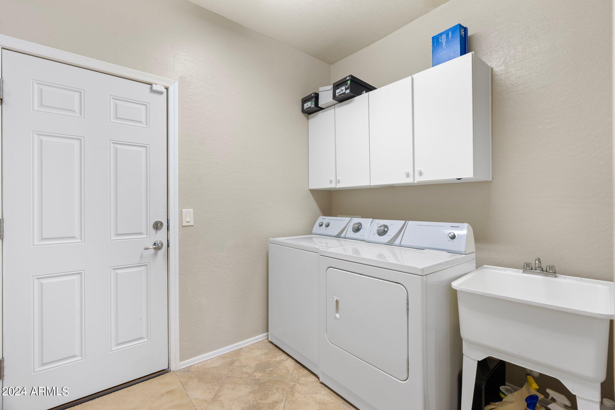 4427 West Summerside Road Laveen, AZ 85339 - Photo 20 of 72 a utility room with dryer and washer