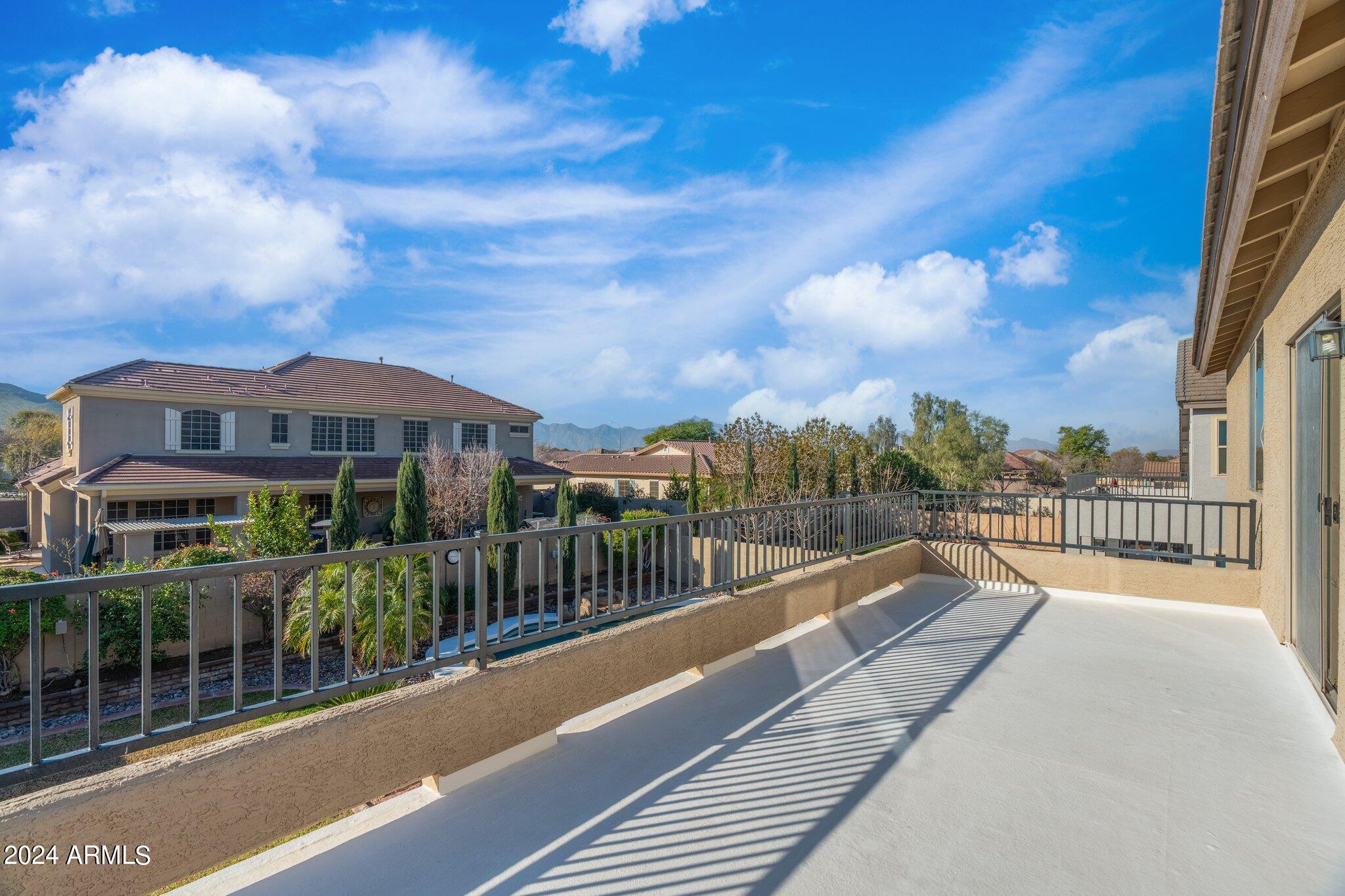 4427 West Summerside Road Laveen, AZ 85339 - Photo 30 of 72 a view of a house with a balcony