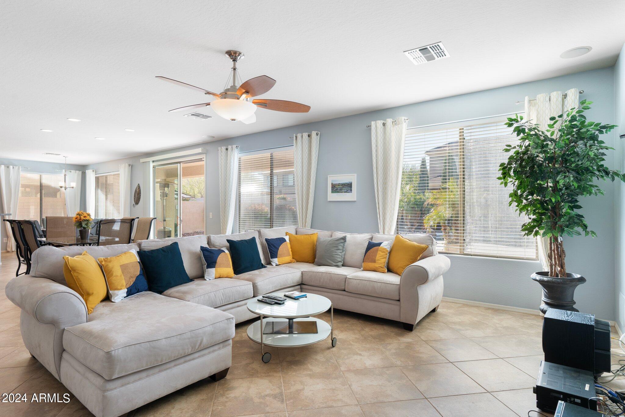 4427 West Summerside Road Laveen, AZ 85339 - Photo 3 of 72 a living room with furniture and a large window