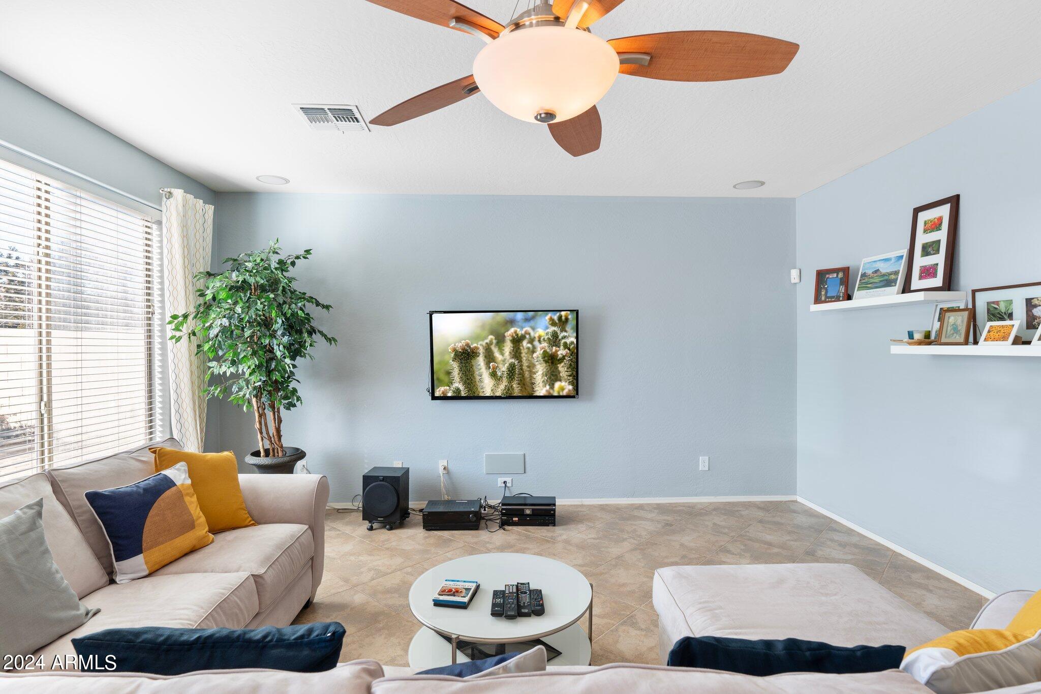 4427 West Summerside Road Laveen, AZ 85339 - Photo 4 of 72 a living room with furniture and a potted plant