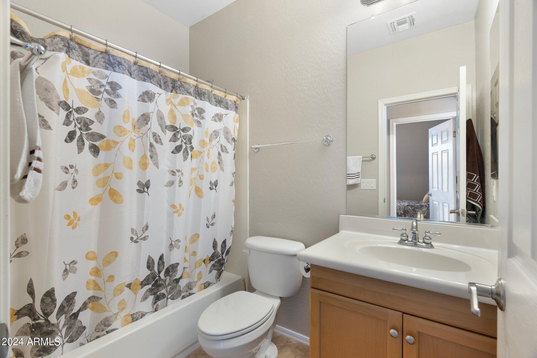 4427 West Summerside Road Laveen, AZ 85339 - Photo 44 of 72 a bathroom with a sink toilet and shower