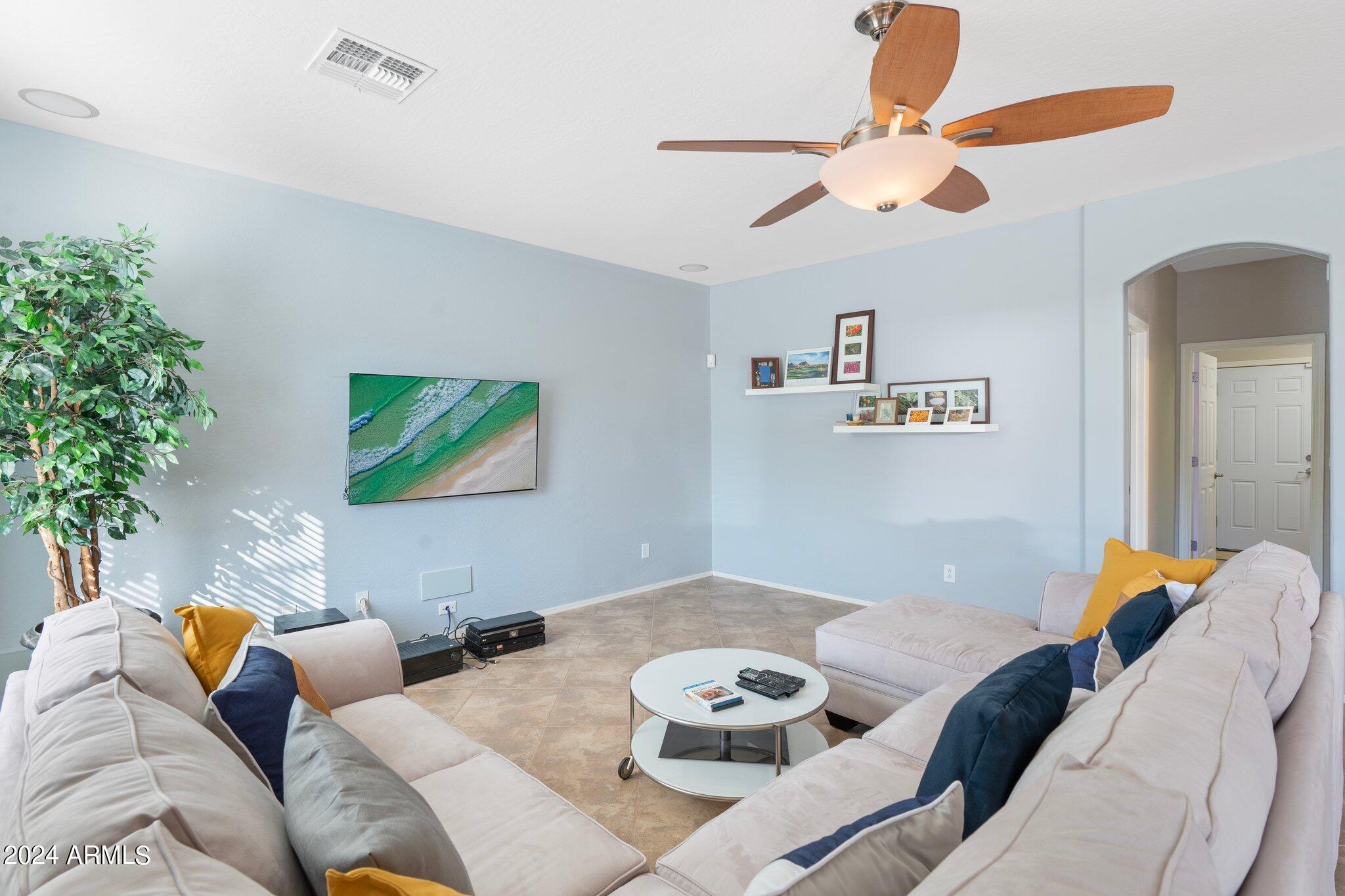 4427 West Summerside Road Laveen, AZ 85339 - Photo 5 of 72 a living room with furniture and a potted plant