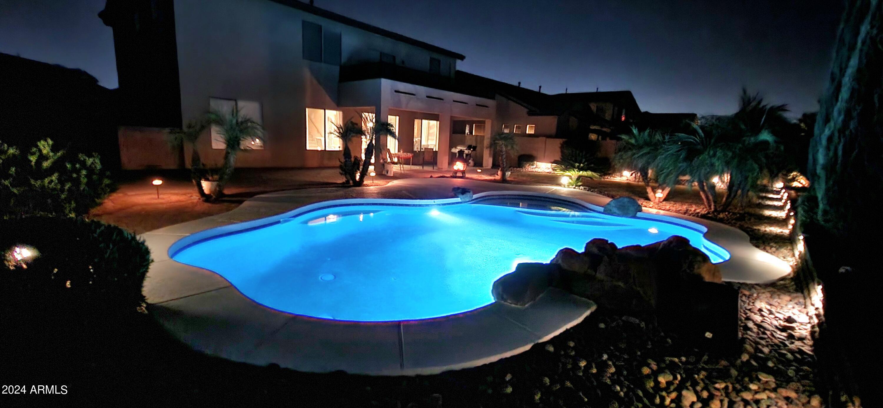 4427 West Summerside Road Laveen, AZ 85339 - Photo 54 of 72 a view of a swimming pool with seating area