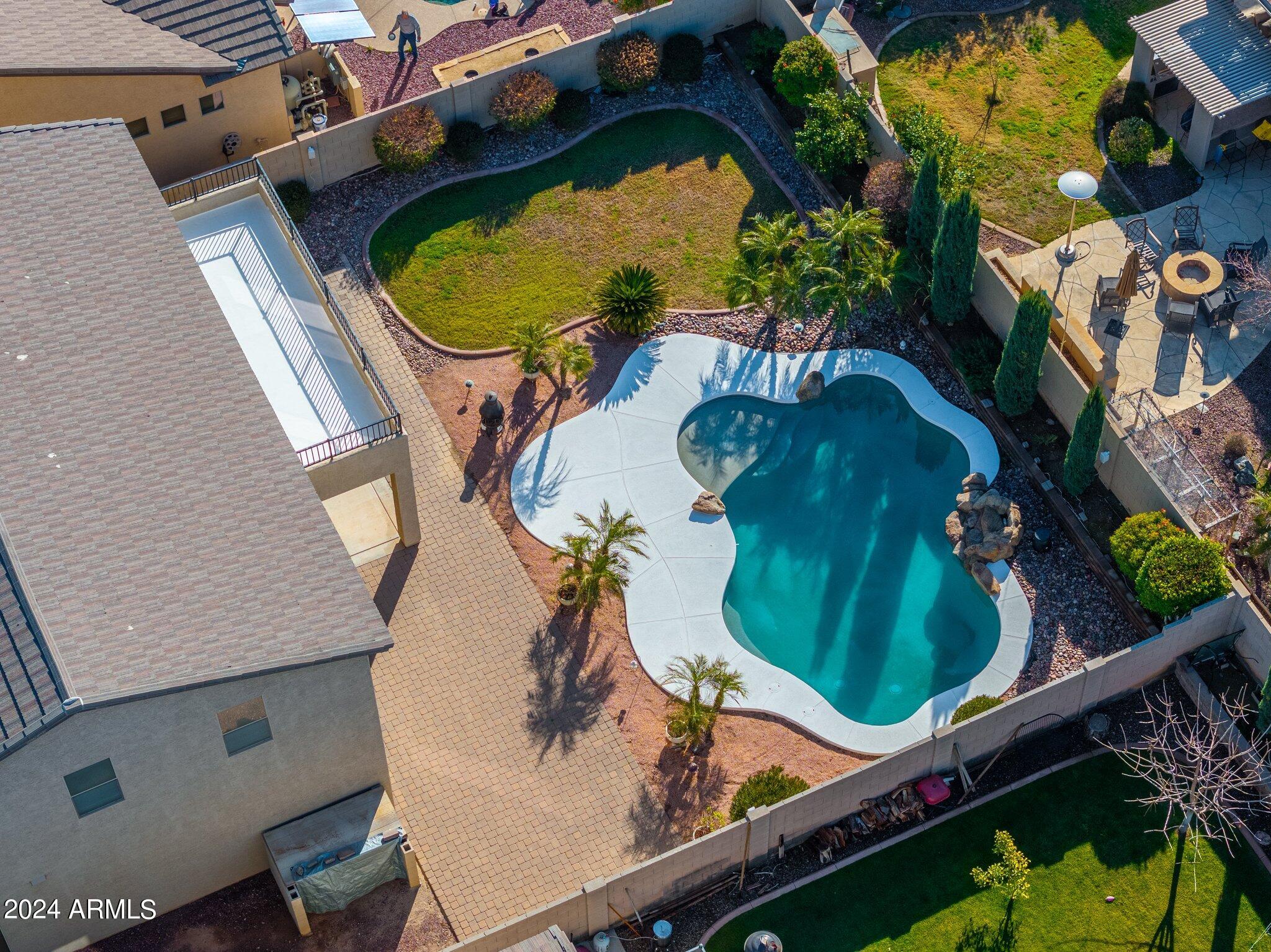 4427 West Summerside Road Laveen, AZ 85339 - Photo 55 of 72 an aerial view of a pool patio swimming pool and outdoor seating