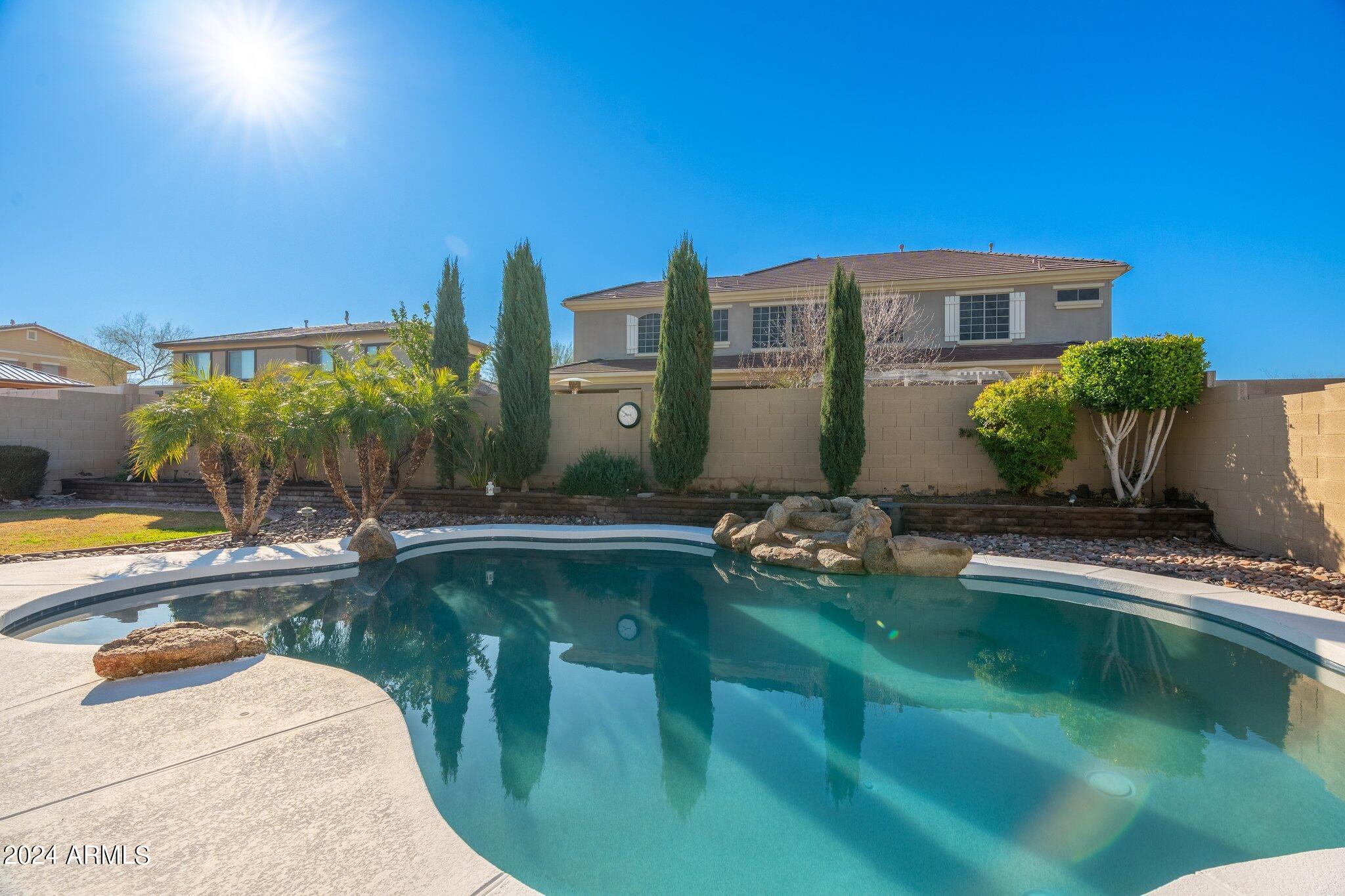 4427 West Summerside Road Laveen, AZ 85339 - Photo 66 of 72 a swimming pool with outdoor seating and yard