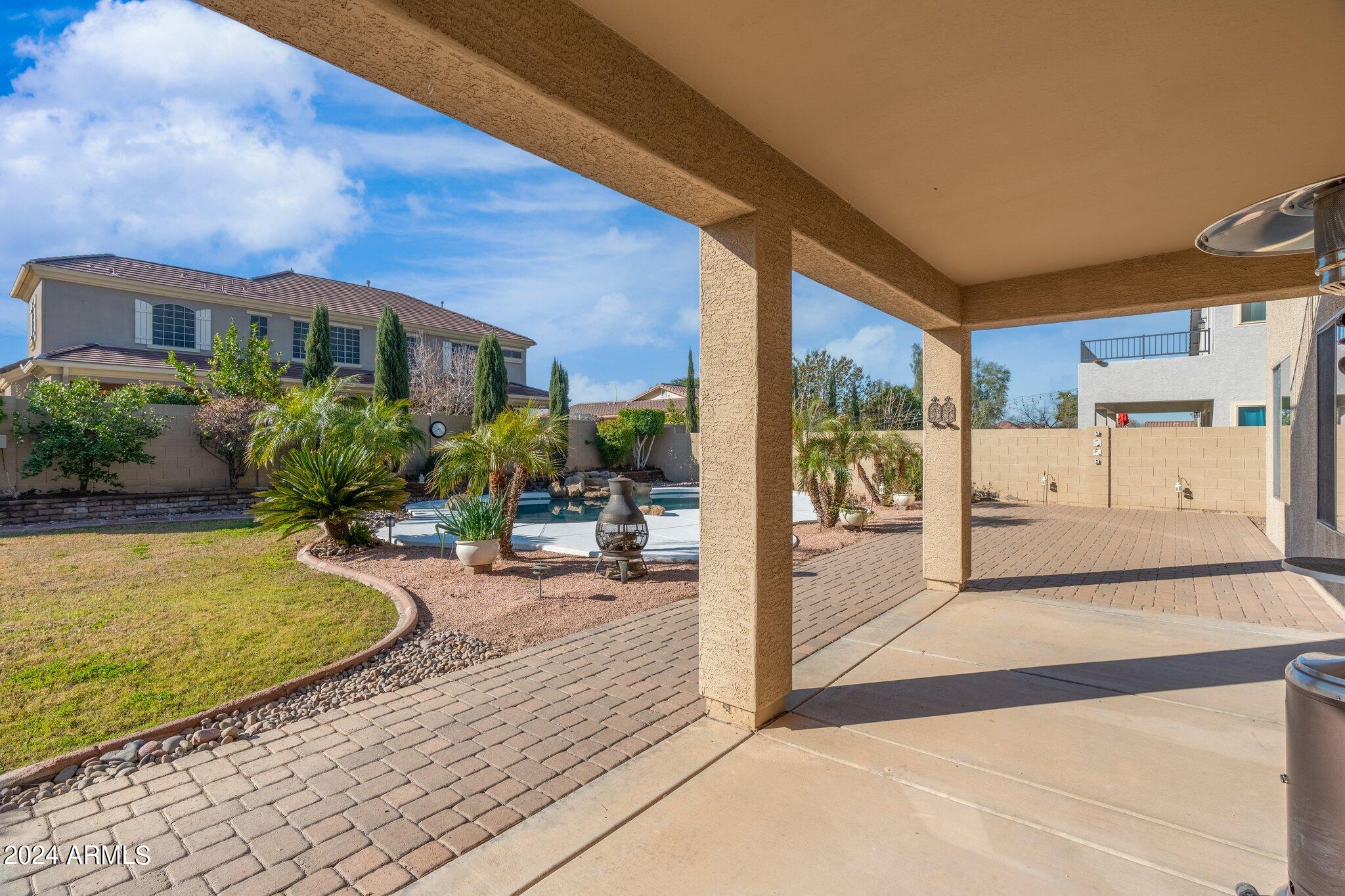 4427 West Summerside Road Laveen, AZ 85339 - Photo 69 of 72 a view of a house with backyard and sitting area