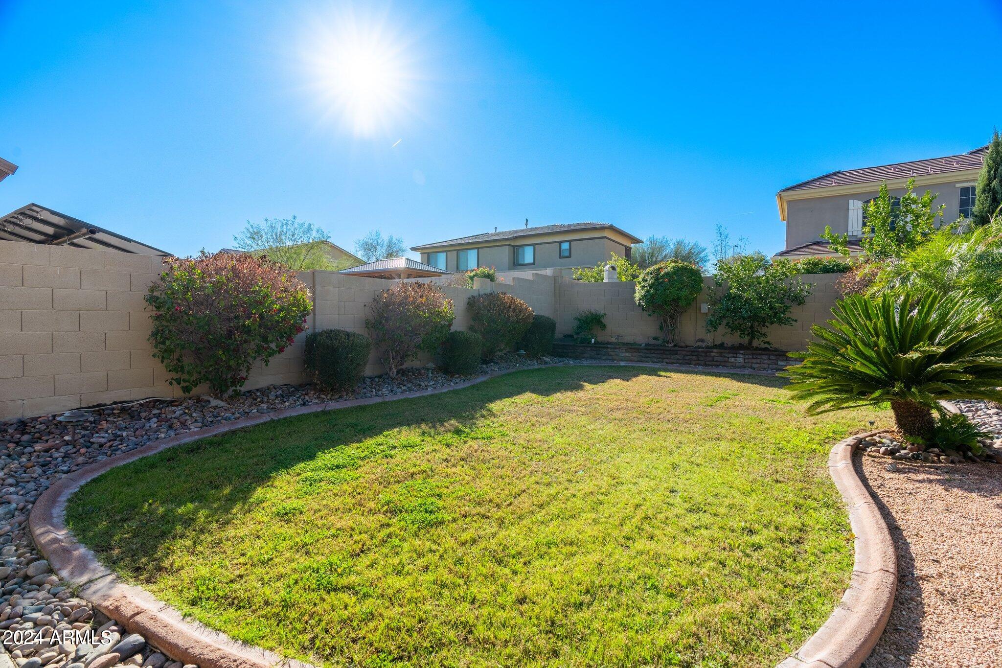 4427 West Summerside Road Laveen, AZ 85339 - Photo 70 of 72 a view of a swimming pool with a yard