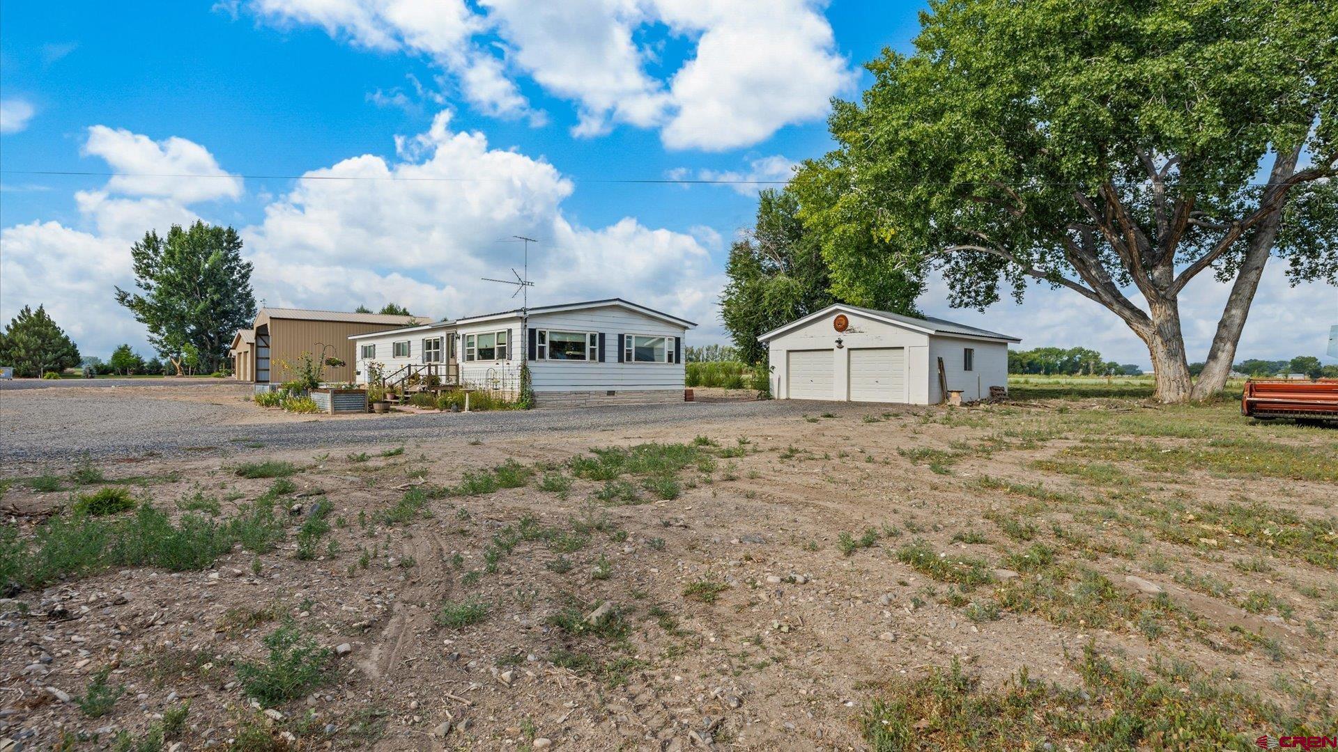 14860 Deer Run Road Delta, CO 81416 - Photo 1 of 33 a front view of a house with garden