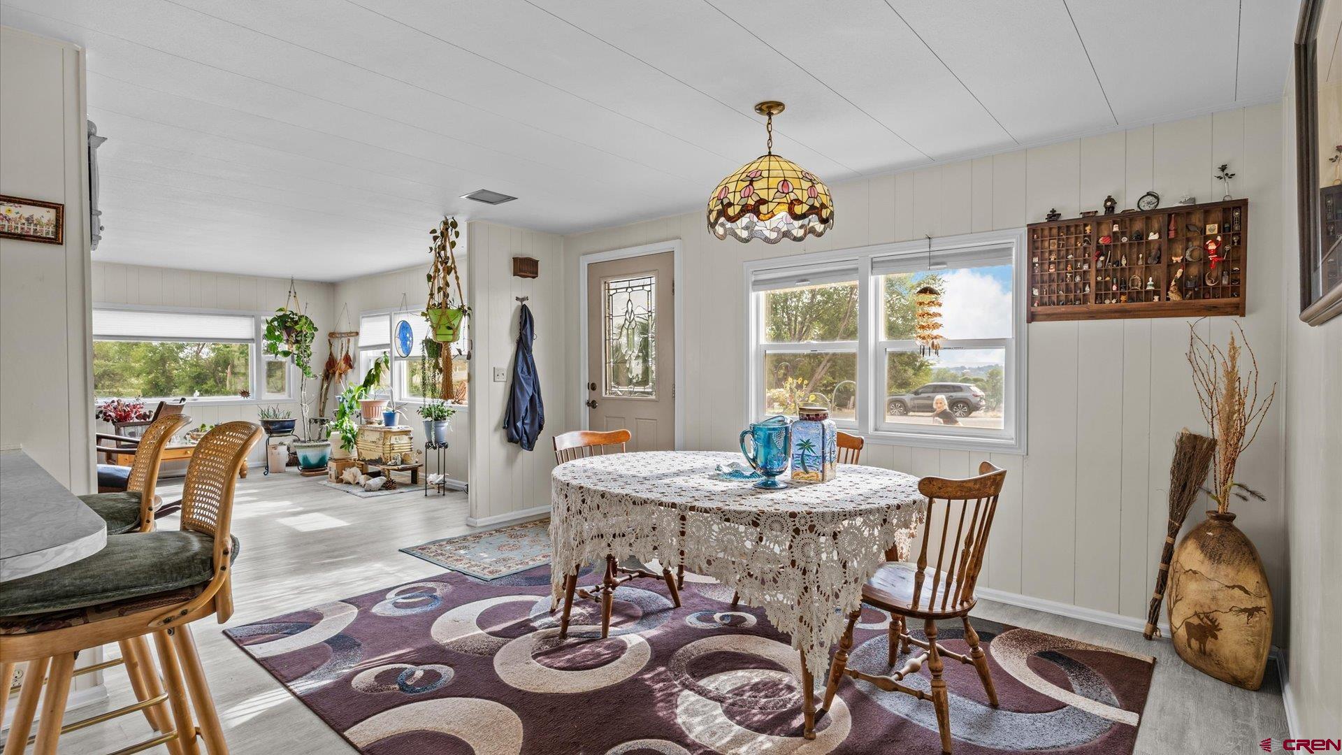 14860 Deer Run Road Delta, CO 81416 - Photo 17 of 33 a view of a dining room with furniture window and wooden floor