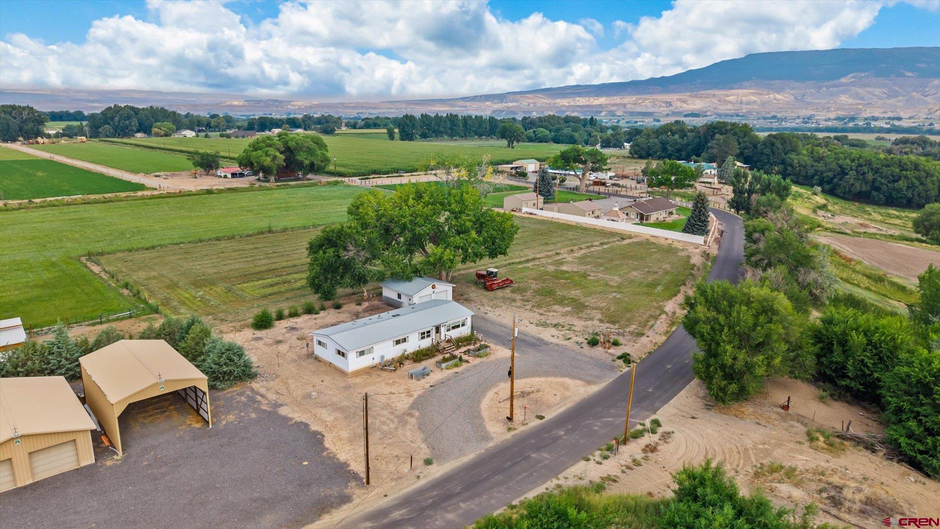 14860 Deer Run Road Delta, CO 81416 - Photo 2 of 33 an aerial view of a house with a yard