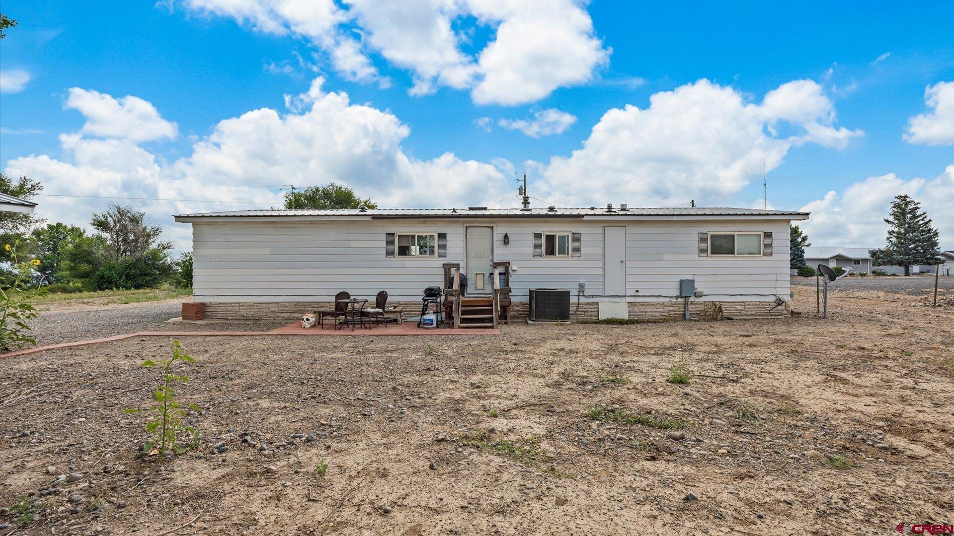 14860 Deer Run Road Delta, CO 81416 - Photo 28 of 33 a view of a house with backyard