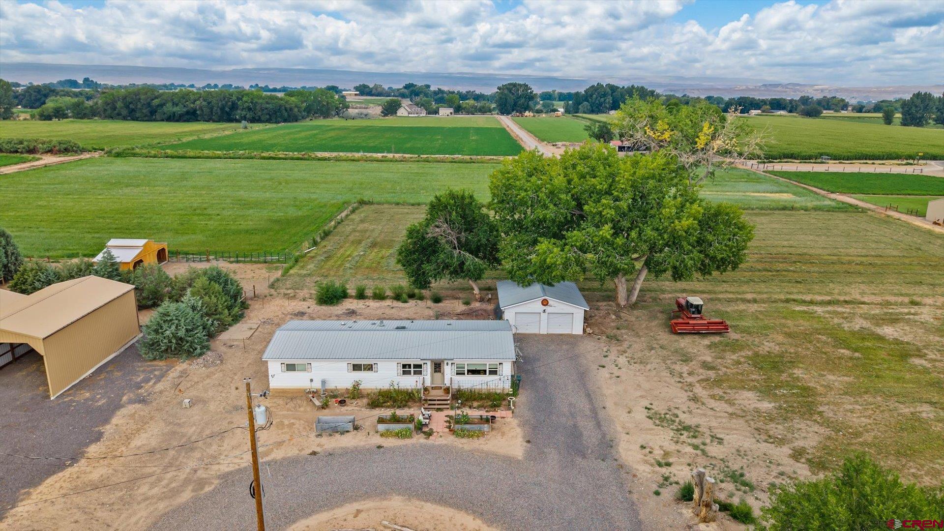 14860 Deer Run Road Delta, CO 81416 - Photo 3 of 33 an aerial view of a house with a yard basket ball court and outdoor seating