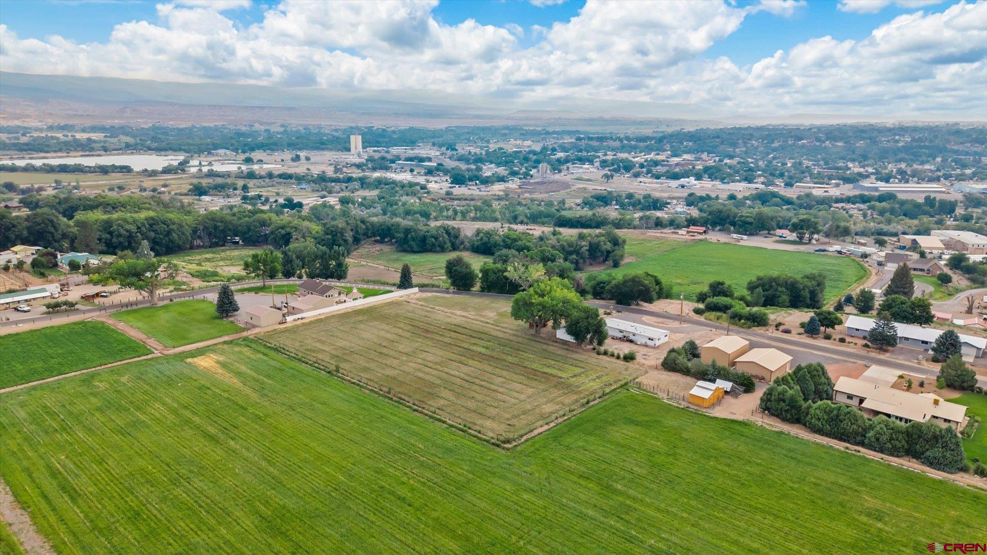 14860 Deer Run Road Delta, CO 81416 - Photo 33 of 33 an aerial view of residential houses with outdoor space and trees