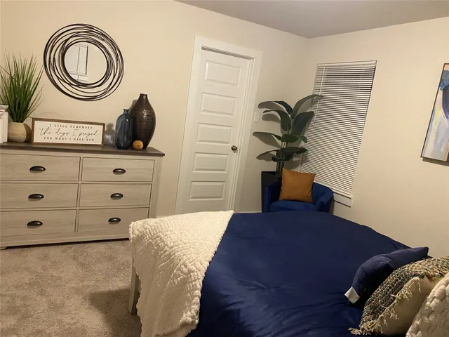 a bedroom with a bed and a cabinets