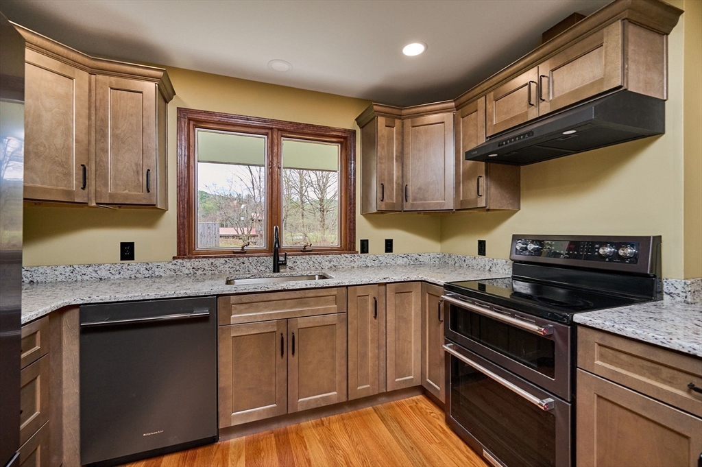 14 East Hawley Road Charlemont, MA 01339 - Photo 7 of 42 a kitchen with a sink stove and cabinets