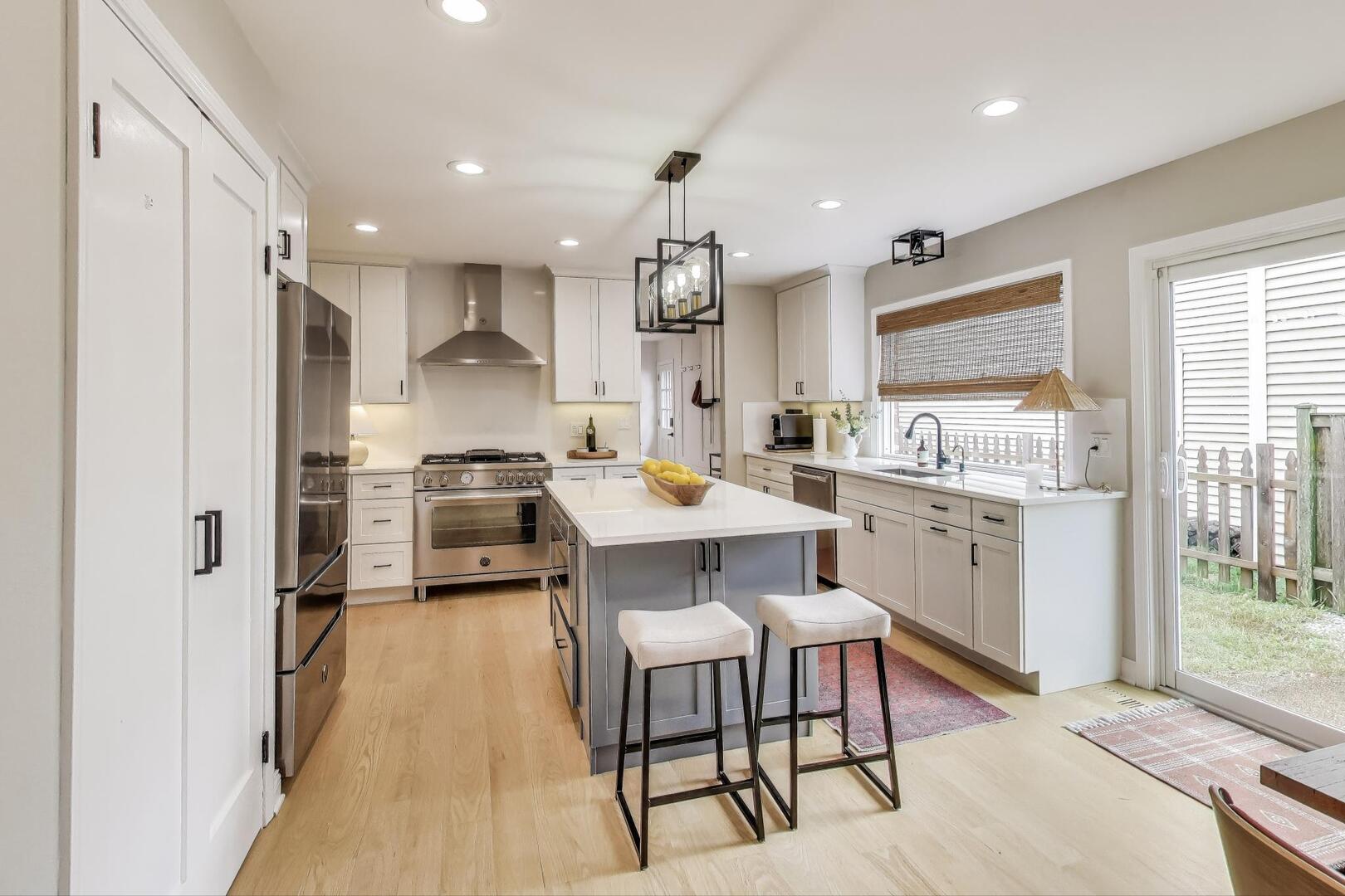 2811 Farmington Road Northbrook, IL 60062 - Photo 13 of 45 a large kitchen with a table chairs refrigerator and cabinets