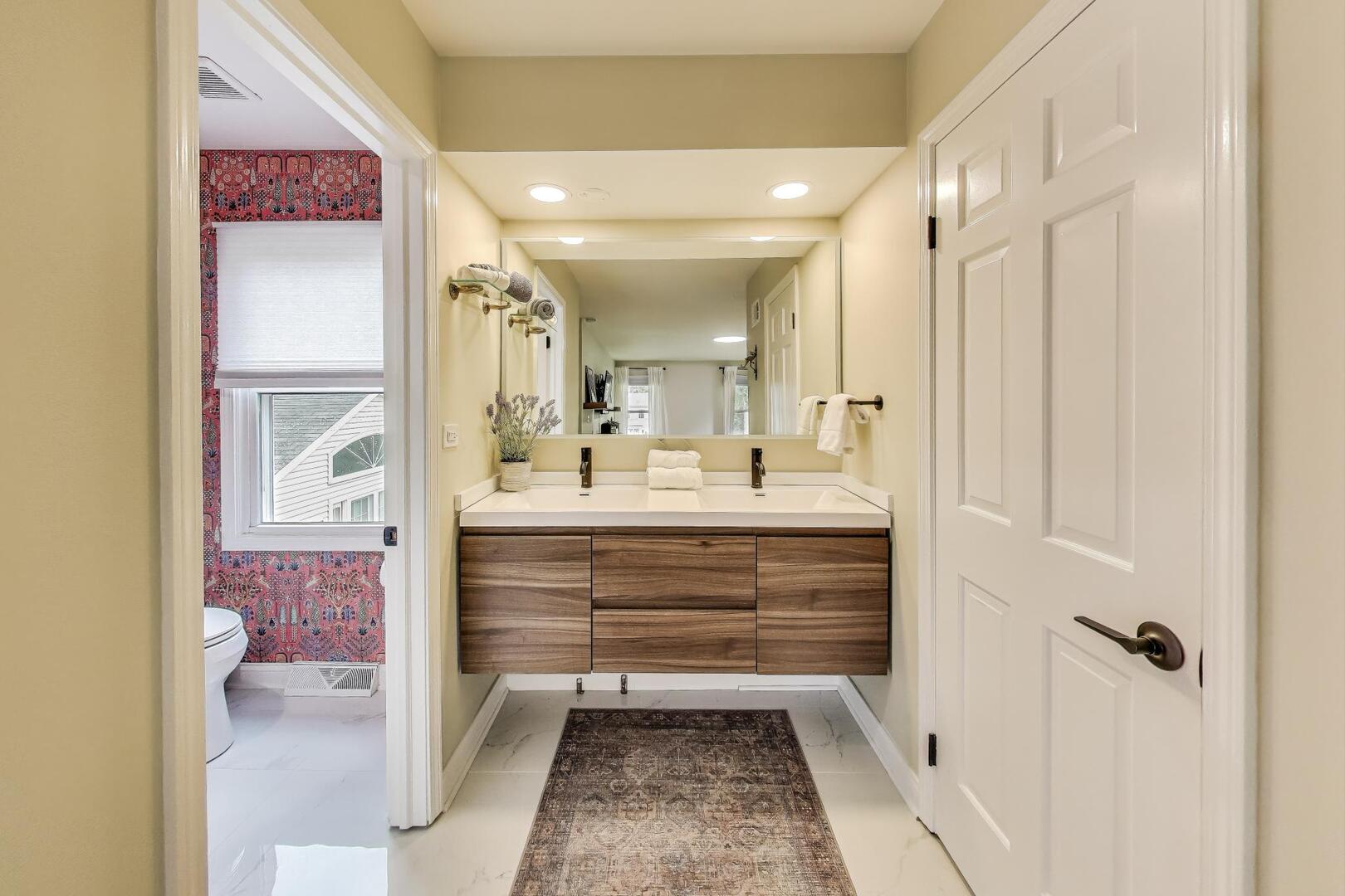 2811 Farmington Road Northbrook, IL 60062 - Photo 24 of 45 a bathroom with a shower sink and mirror