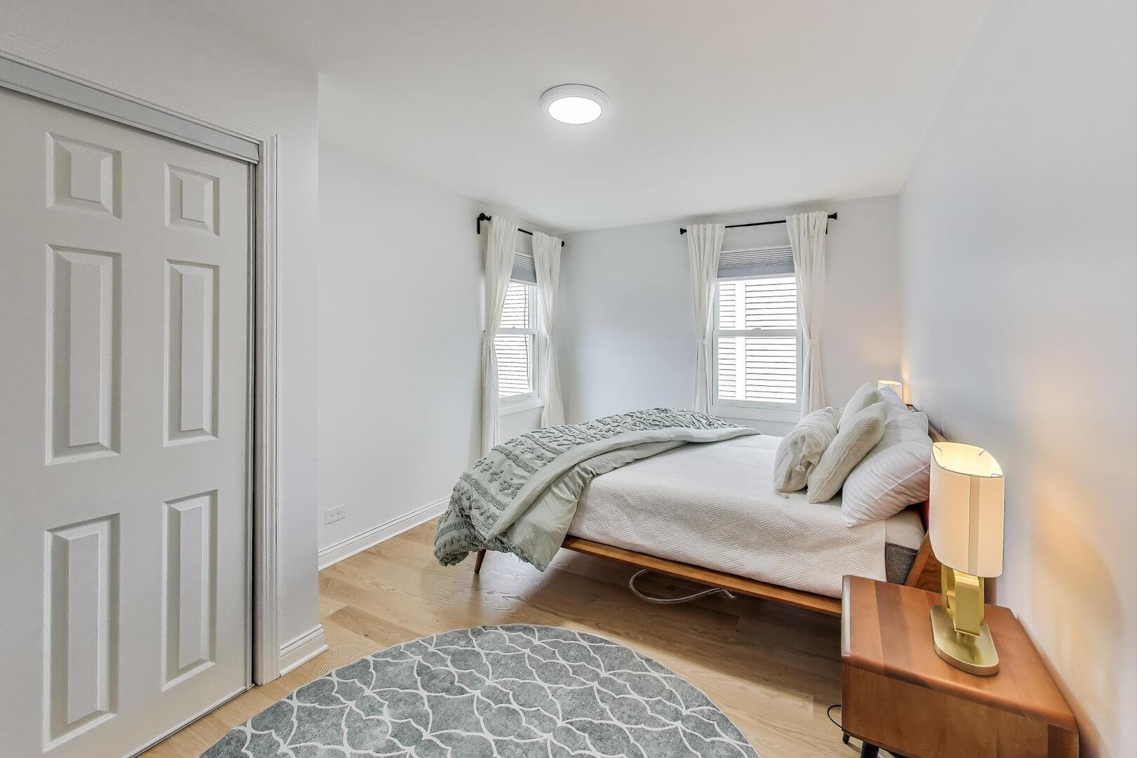 2811 Farmington Road Northbrook, IL 60062 - Photo 29 of 45 a bedroom with furniture and a window