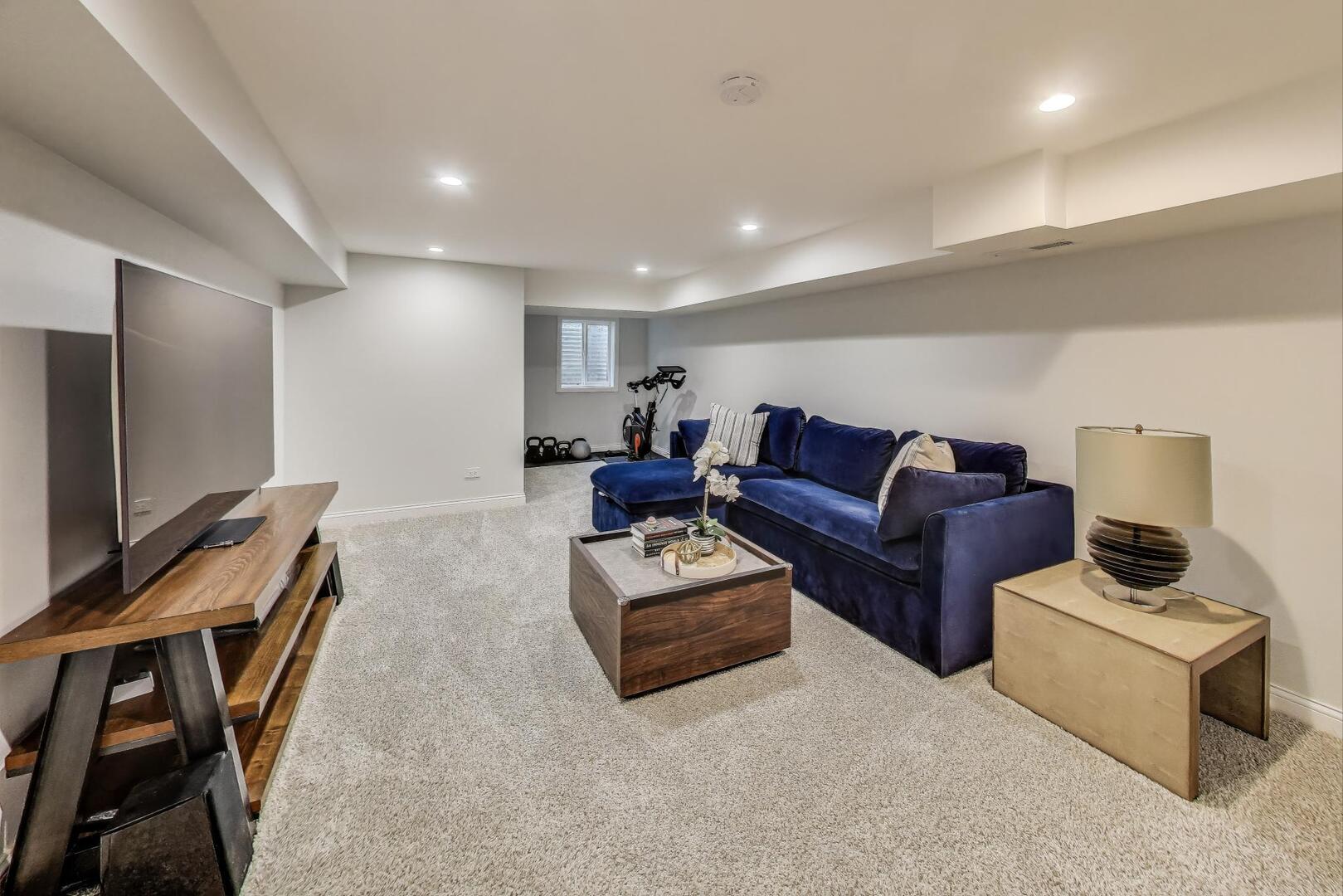 2811 Farmington Road Northbrook, IL 60062 - Photo 35 of 45 a living room with furniture and a flat screen tv
