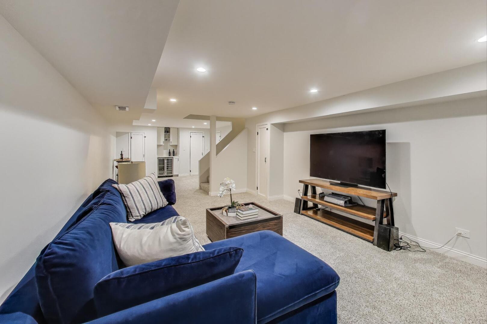 2811 Farmington Road Northbrook, IL 60062 - Photo 36 of 45 a living room with furniture and a flat screen tv