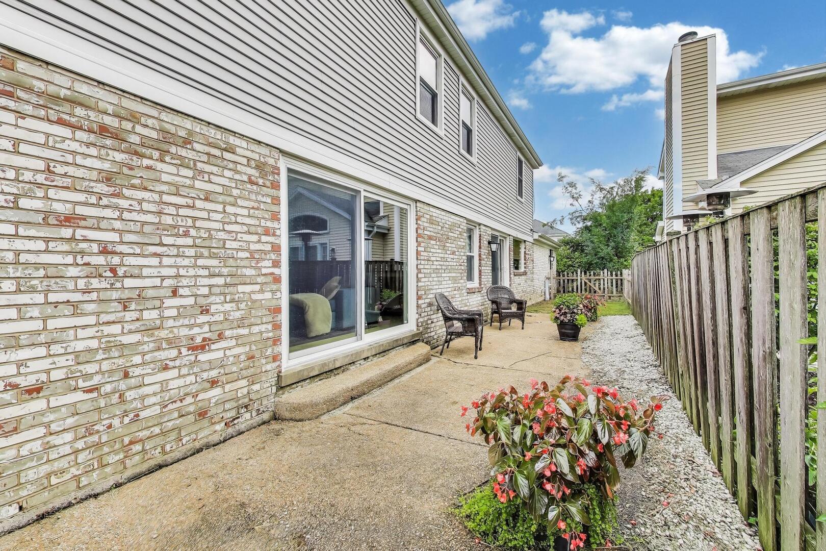 2811 Farmington Road Northbrook, IL 60062 - Photo 40 of 45 a view of a chair and table in the backyard