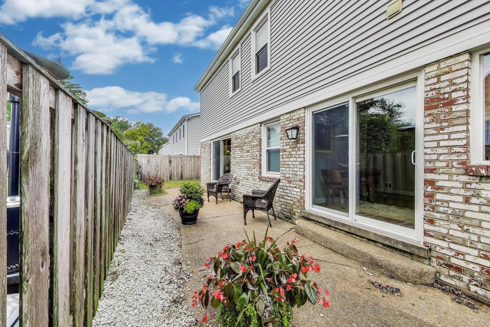2811 Farmington Road Northbrook, IL 60062 - Photo 41 of 45 a view of a patio with table and chairs and potted plants
