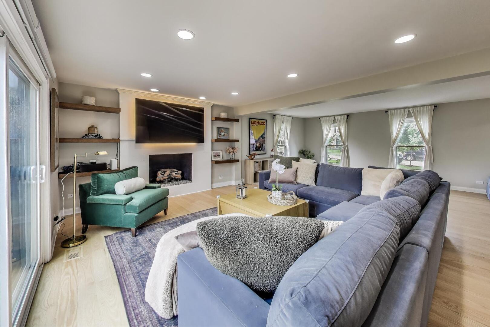 2811 Farmington Road Northbrook, IL 60062 - Photo 6 of 45 a living room with fireplace furniture and a flat screen tv