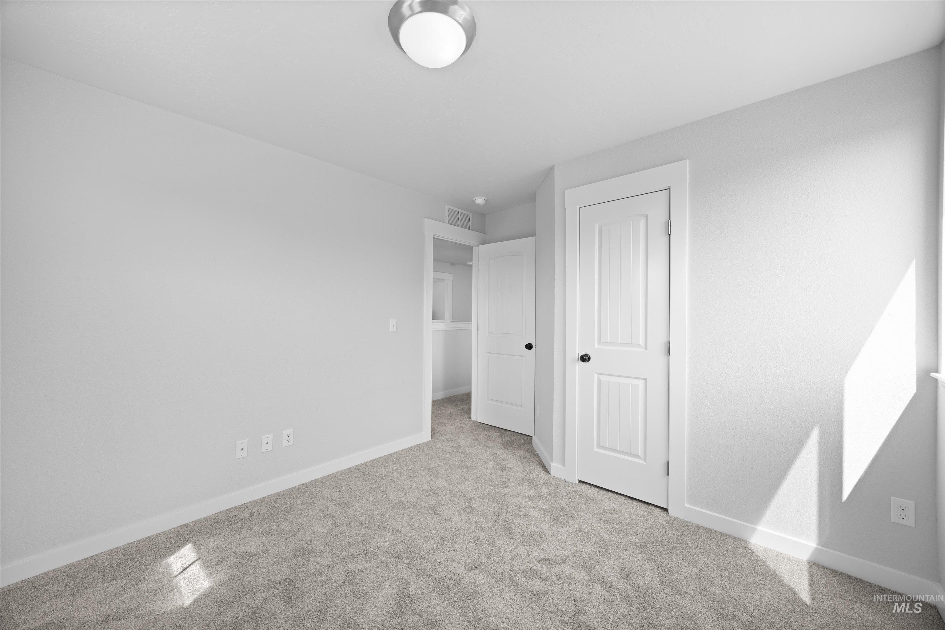 300 South Rocker Avenue Kuna, ID 83634 - Photo 24 of 49 Neutral gray wall finishes complementing light gray carpeting