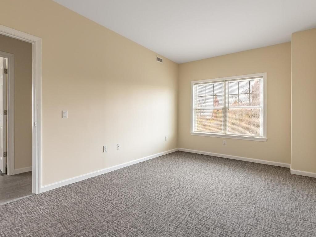 73 North Common Street, Unit 12 Lynn, MA 01902 - Photo 15 of 30 an empty room with windows