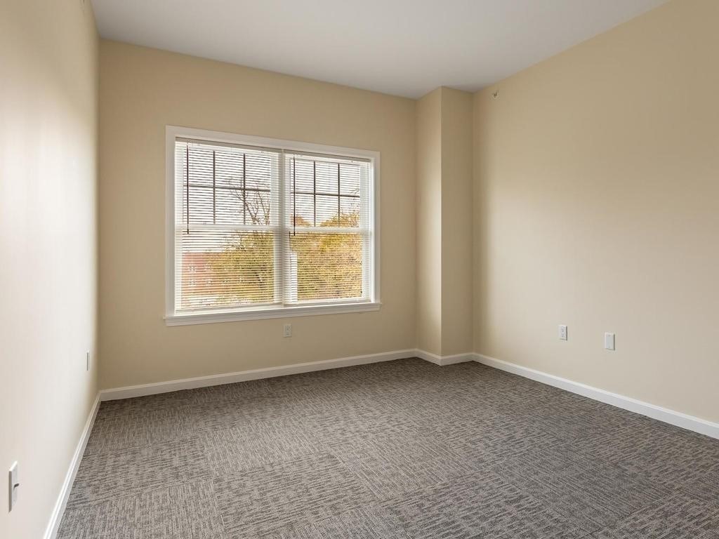 73 North Common Street, Unit 12 Lynn, MA 01902 - Photo 16 of 30 an empty room with a window