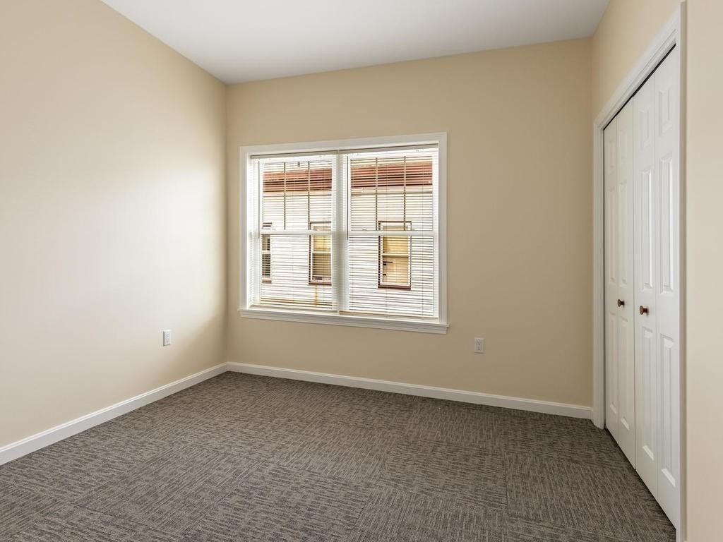 73 North Common Street, Unit 12 Lynn, MA 01902 - Photo 17 of 30 an empty room with a window
