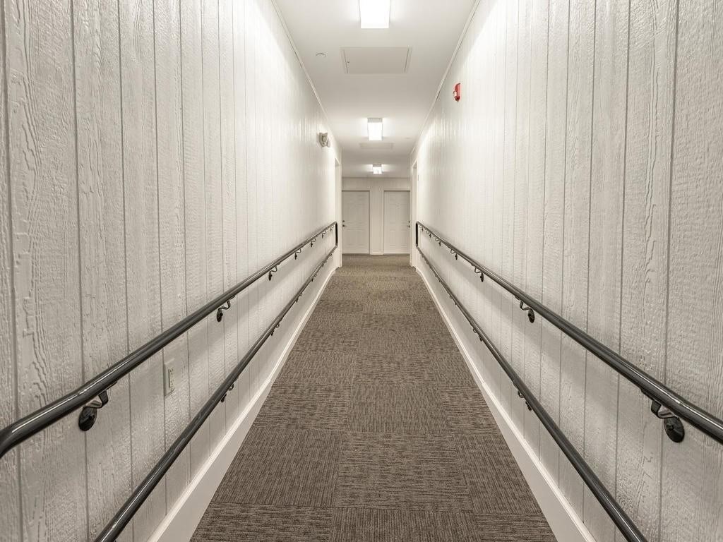 73 North Common Street, Unit 12 Lynn, MA 01902 - Photo 23 of 30 a view of a hallway with wooden floor
