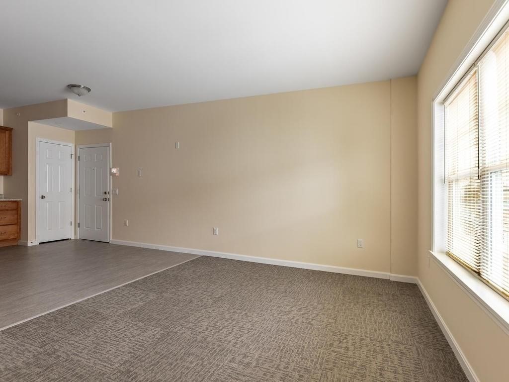 73 North Common Street, Unit 12 Lynn, MA 01902 - Photo 8 of 30 an empty room with windows