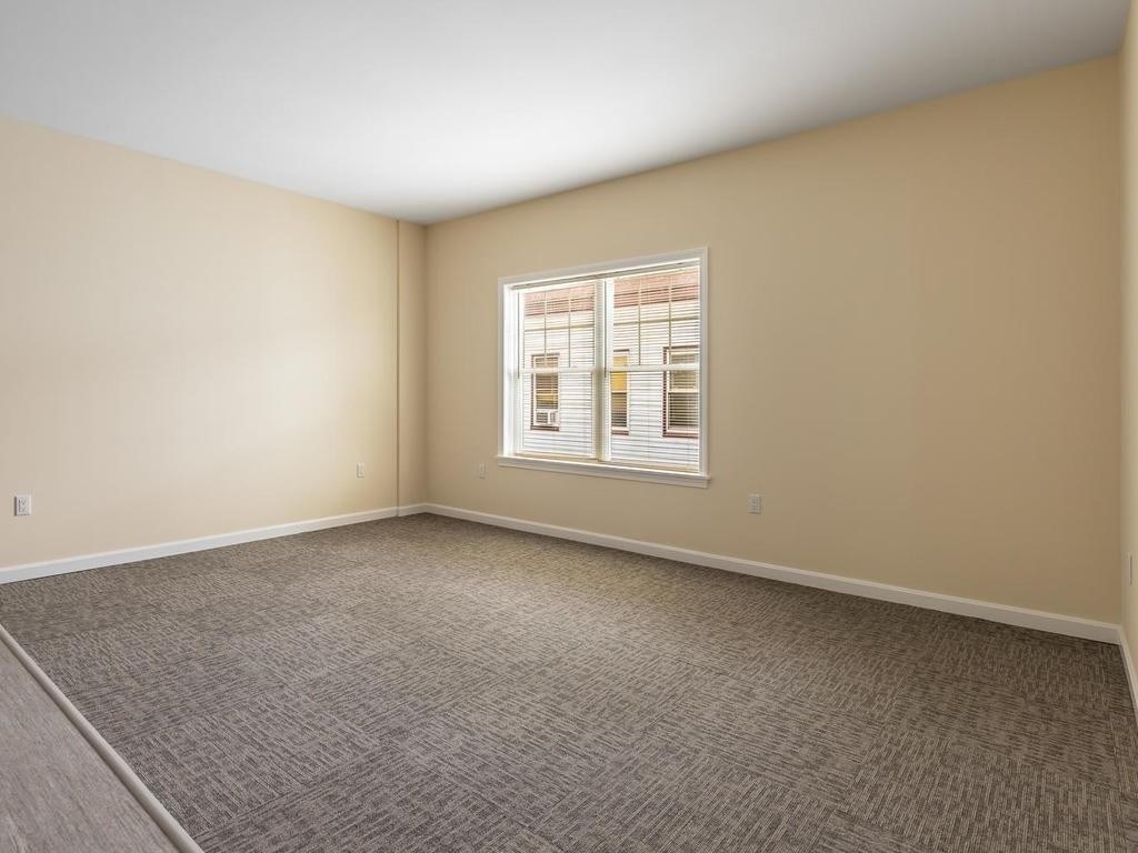73 North Common Street, Unit 12 Lynn, MA 01902 - Photo 9 of 30 an empty room with a empty space and window