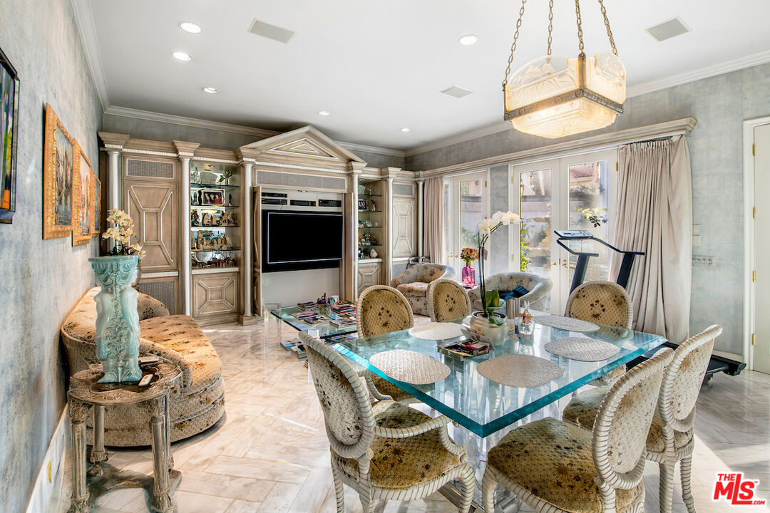10275 Century Woods Drive Los Angeles, CA 90067 - Photo 14 of 42 a dining room with furniture a chandelier and window