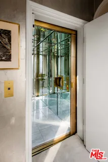 a view of a hallway with a glass door