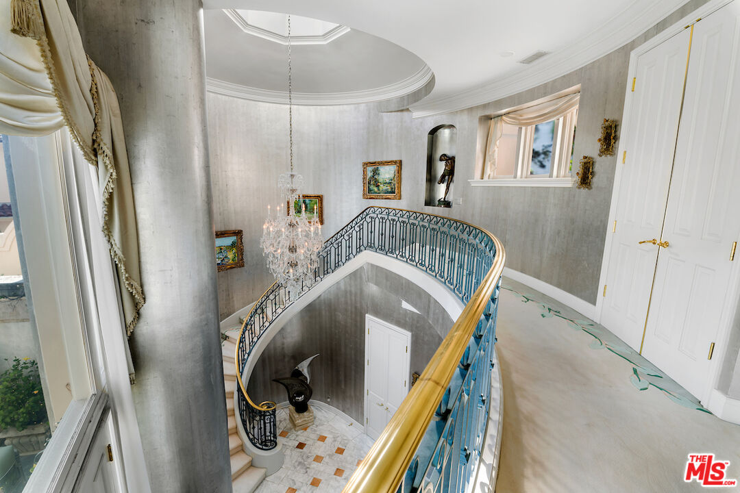 10275 Century Woods Drive Los Angeles, CA 90067 - Photo 18 of 42 a living room with furniture and a wooden floor