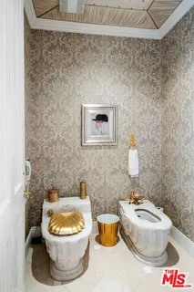 a bathroom with a toilet and a sink