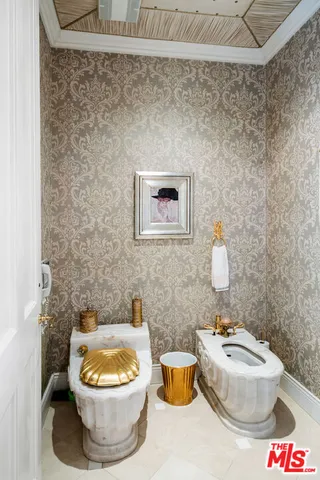 a bathroom with a toilet and a sink