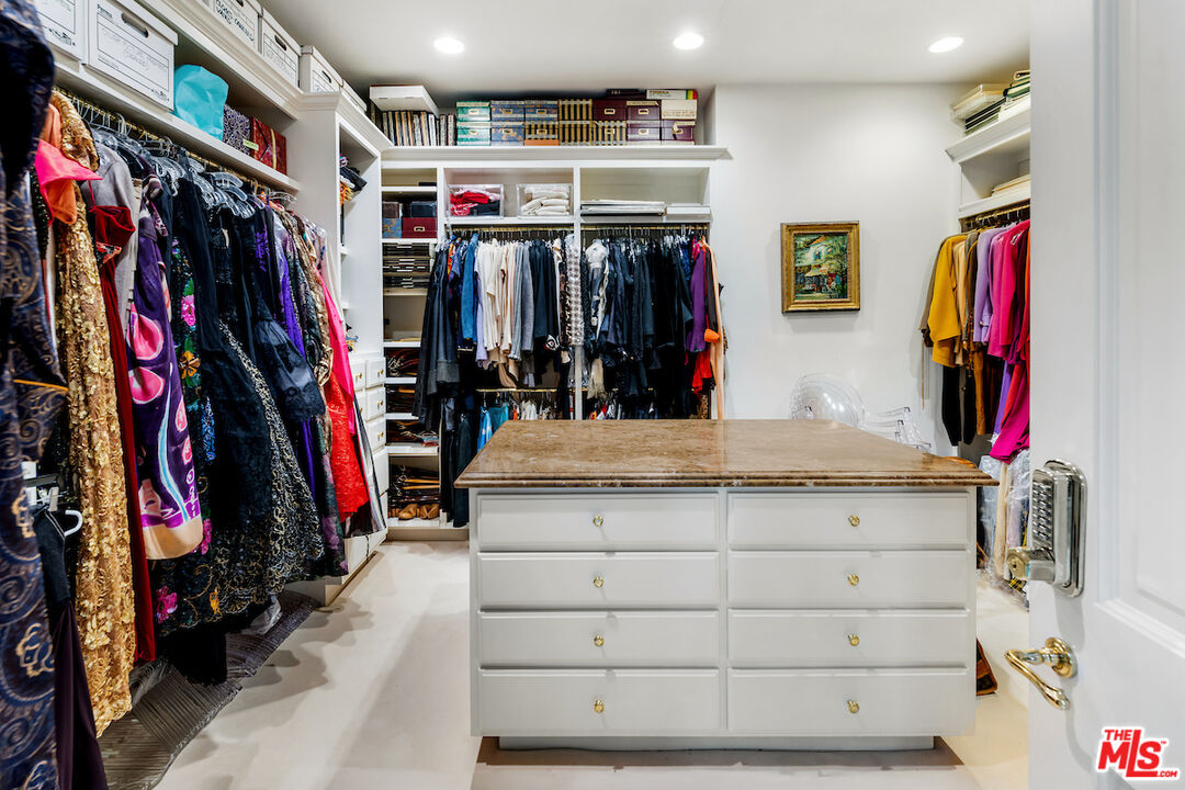 10275 Century Woods Drive Los Angeles, CA 90067 - Photo 32 of 42 a view of walk in closet with clothes