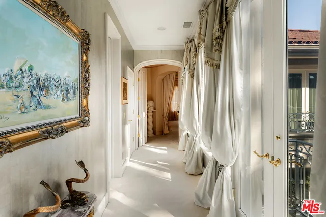 a spacious bedroom with a bed and a couch