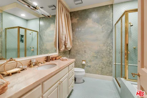 a living room with furniture cabinets and a book shelf