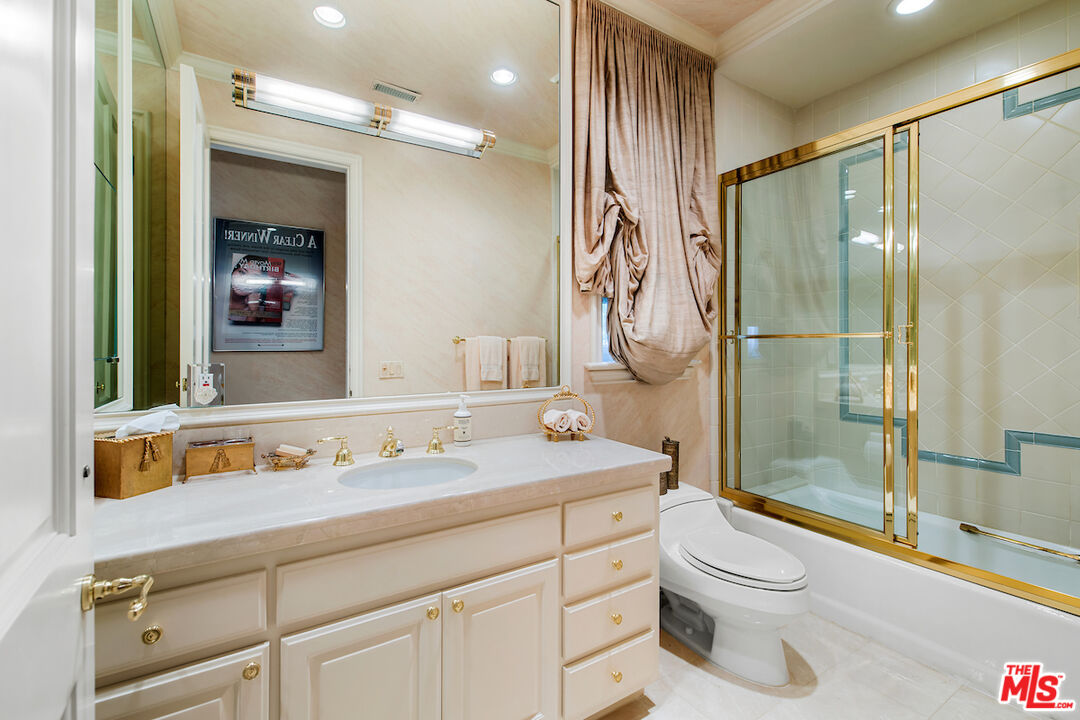 10275 Century Woods Drive Los Angeles, CA 90067 - Photo 39 of 42 a bathroom with a sink a toilet and shower