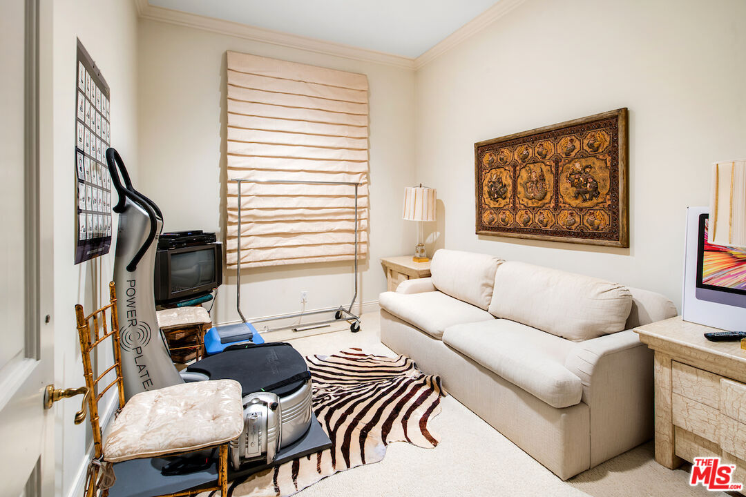 10275 Century Woods Drive Los Angeles, CA 90067 - Photo 40 of 42 a living room with furniture and a flat screen tv