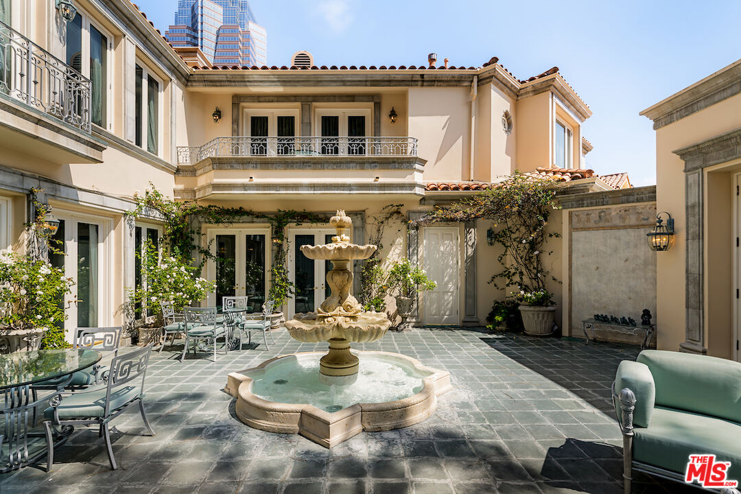 10275 Century Woods Drive Los Angeles, CA 90067 - Photo 5 of 42 a view of a building with outdoor seating