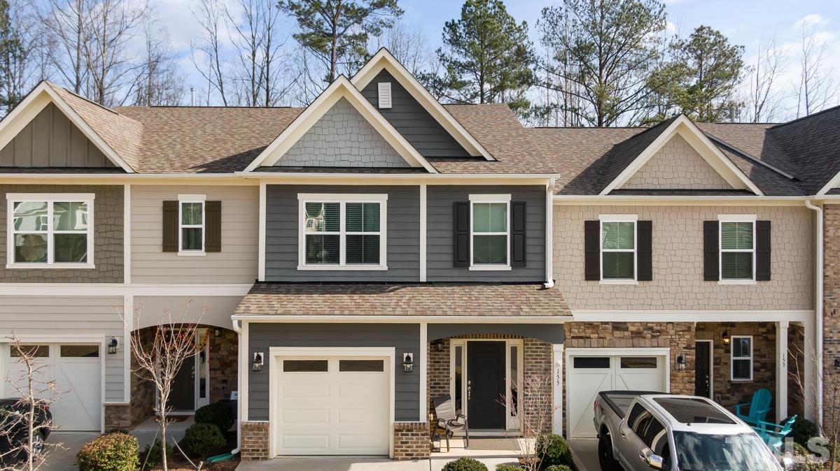 a front view of a house with many windows